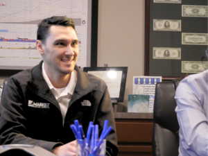 Trey at table Market Medicare Advisors staff